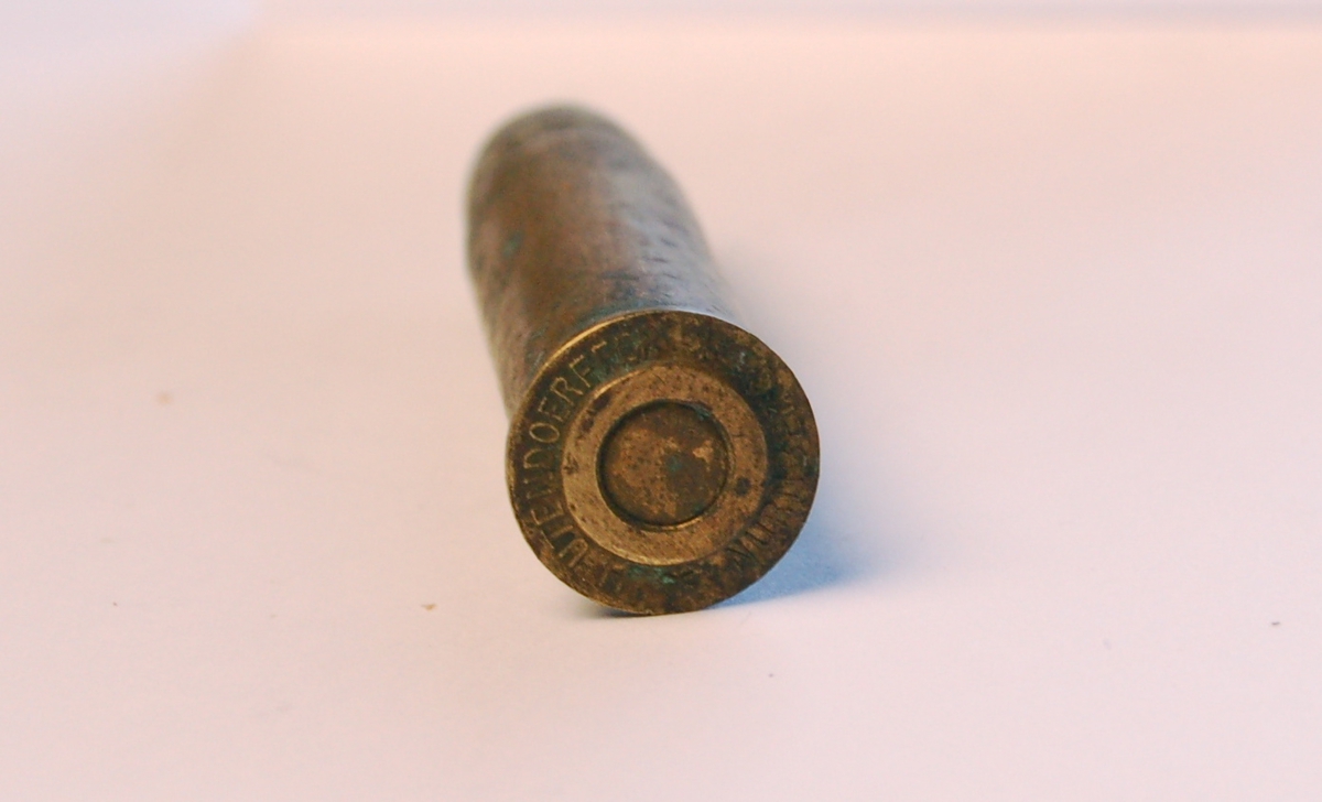 Fulladet rørformet geværpatrone i 12,17 mm. med blykule.