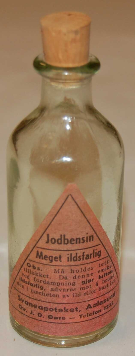 Rund sylindrisk flaskeformet medisinglas.