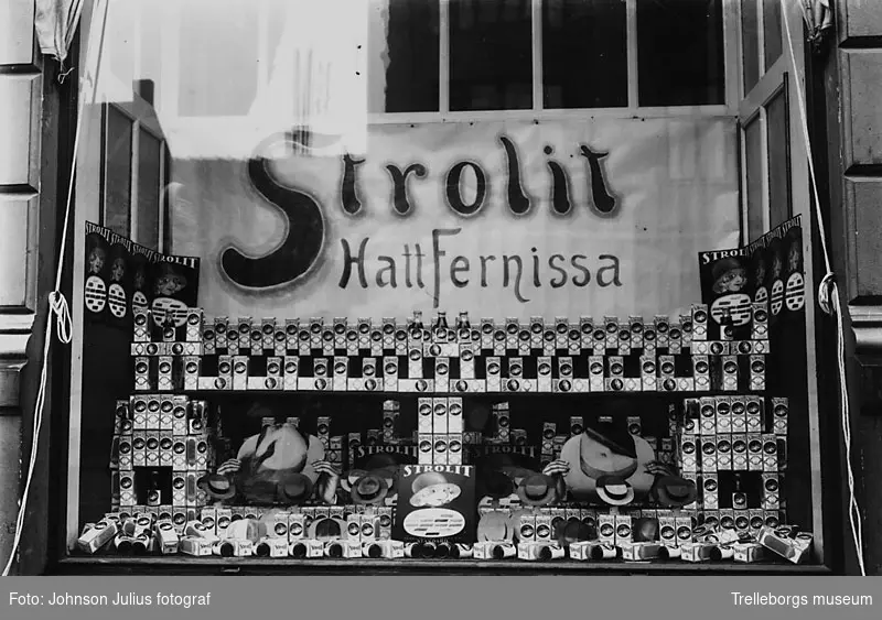 Karl Asks färghandel år 1924. Man gör reklam för Strolit Hattfernissa.