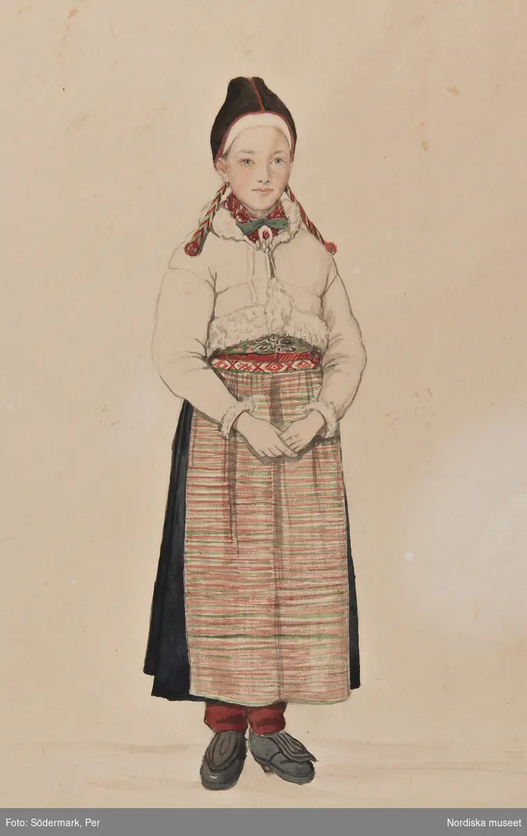 Kvinna i Rättviksdräkt med skinntröja. Akvarell av P.Södermark.