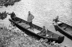 Elvebåt i landskap.