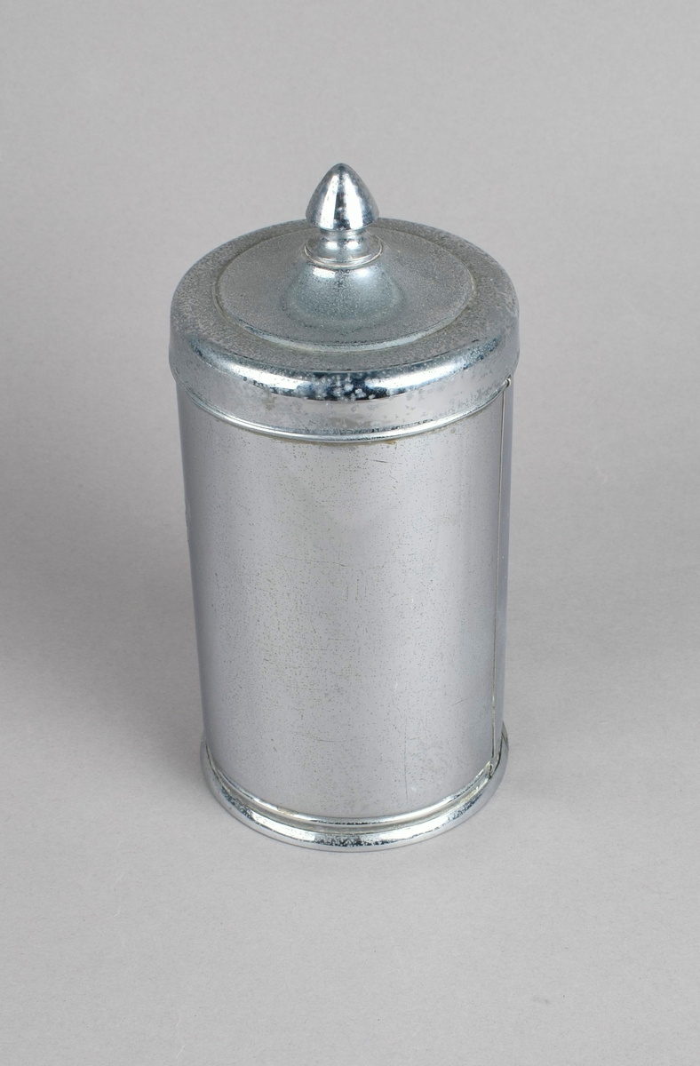 Sylinderformet boks med lokk. Glassylinder innvendig.