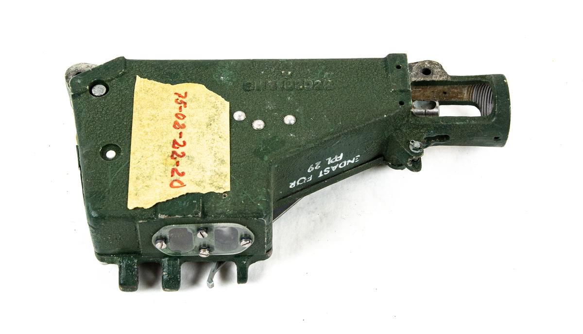 Tidutlösare tillverkad av SAAB S1047257-1 i grönlackerad metall och med en inre fjäder-mekanism.
Påklistard tejp med påskrift 75-02-22-20.