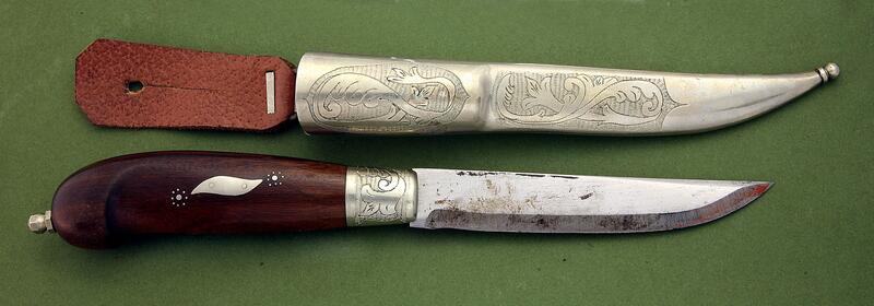 Typical knife by Hedenberg, made in silver and birch with embellishments. Trampling, acantus roses and inlays.