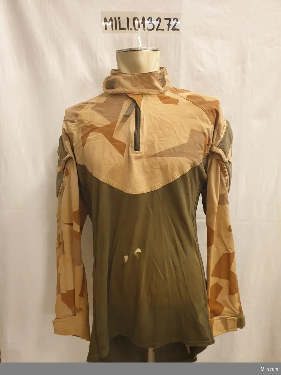 Stridsskjorta, civil, Taiga "Torraka" Combat UAC shirt 2.0. storlek L. 

Skador på magpartiet.