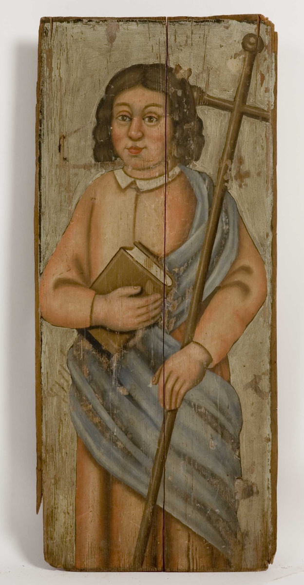 Mannsperson med bok i høyre hånd og en korsstav i den venstre som kjennetegnes som apostelen Filips attributt. 