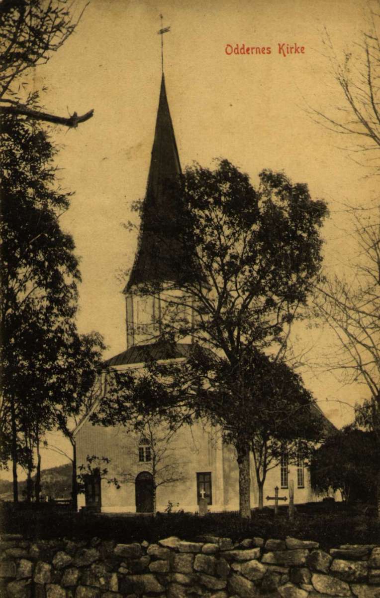 Postkort. Julehilsen. Fotografisk motiv. Svart/hvitt. Oddernes Kirke. Trær. Stemplet 19.12.1910.