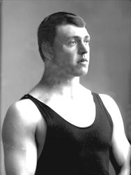 Portrett, mann i singlet, treningstrøye. Olympier og bryter 