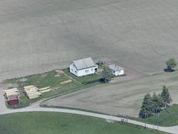 Skråfoto av villa og sagbruk ved Gautestad stasjon i Rakkest