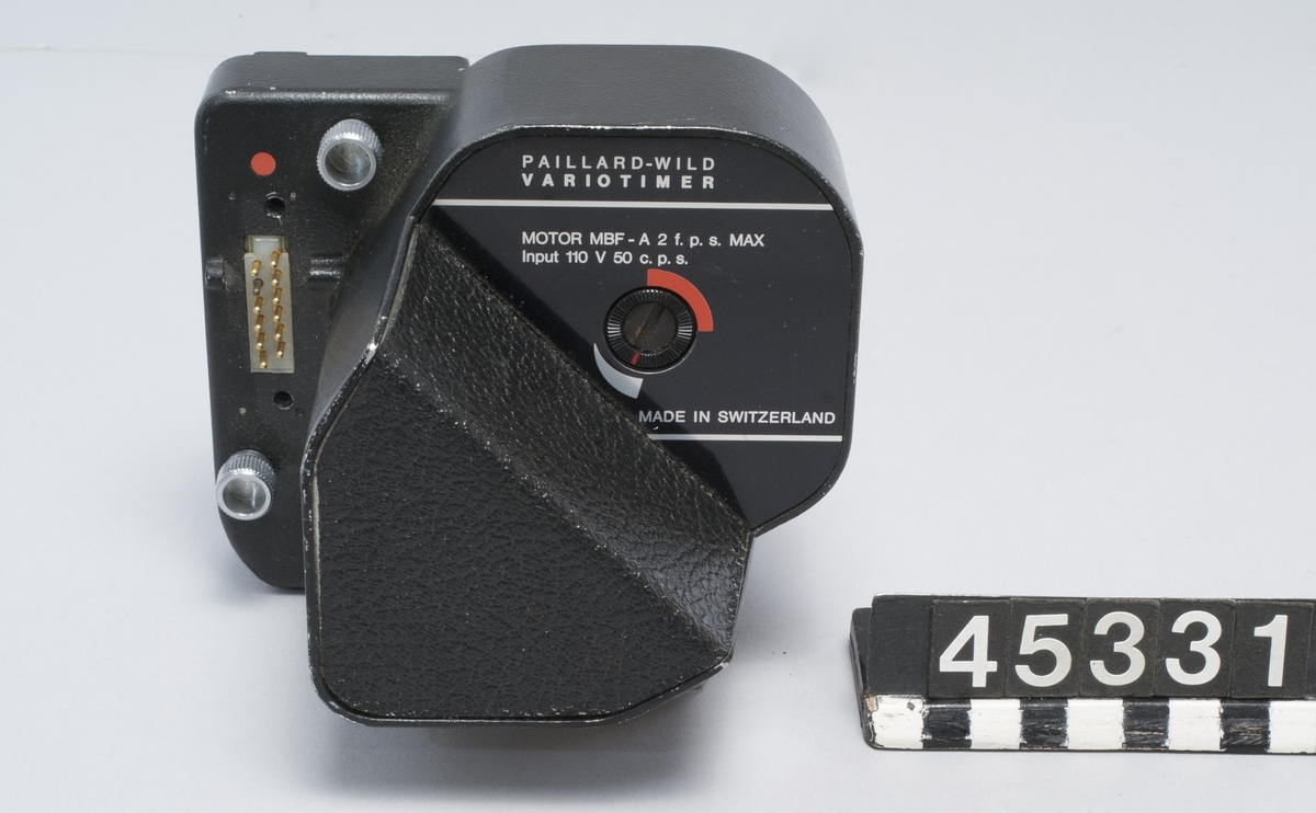 Timerstyrd motor för enbildstagning med Bolex Paillard 16 mm filmkamera. Tillverkare Paillard-Wild typ Variotimer MBF-A, maximalt 2 bilder per sekund. För 110 V 50 perioder nätdrift.