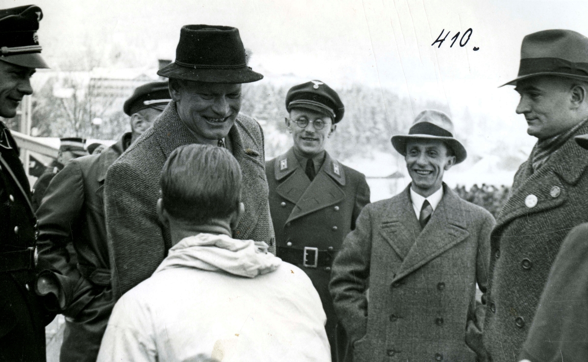 Birger Ruud is greeted by officials at Garmisch