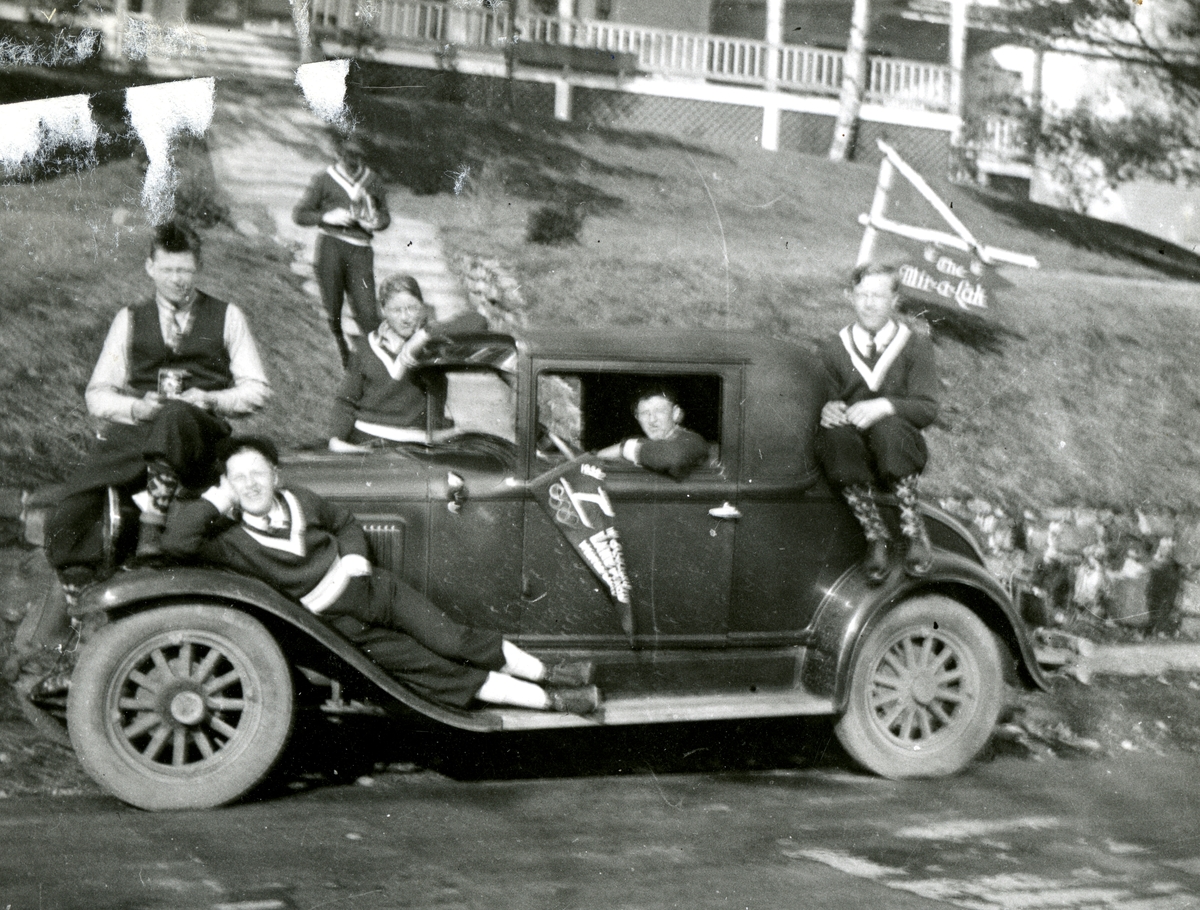 The Norwegian ski jumping team and a car