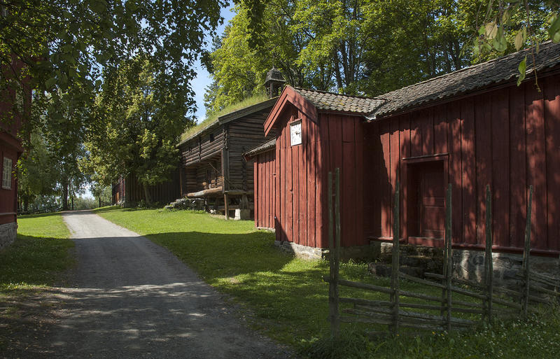 Old, red wooden house in the open air museum.