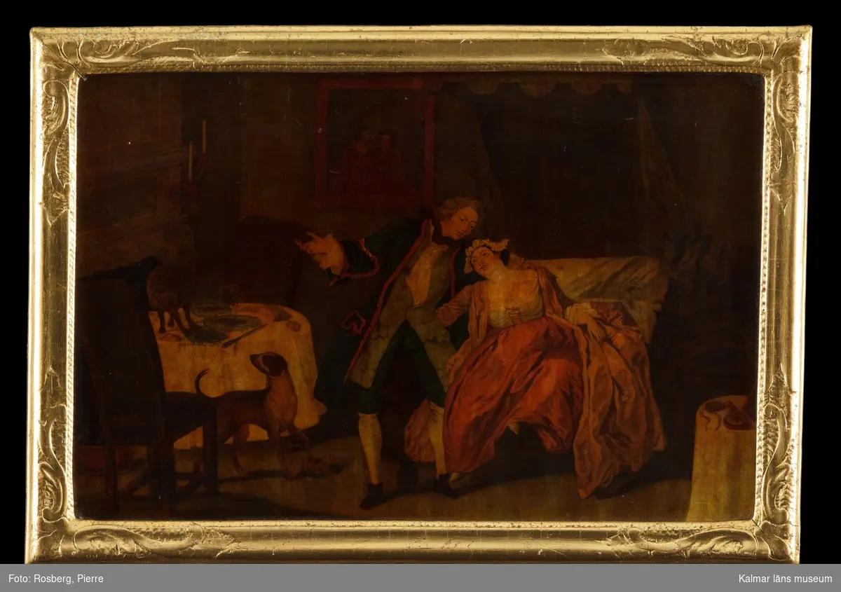 Kärleksscen, 1700-talets mitt. Interiör med en man och en kvinna på en säng upptagna av varandra. Till vänster ett dukat bord, på golvet framför bordet en hund.