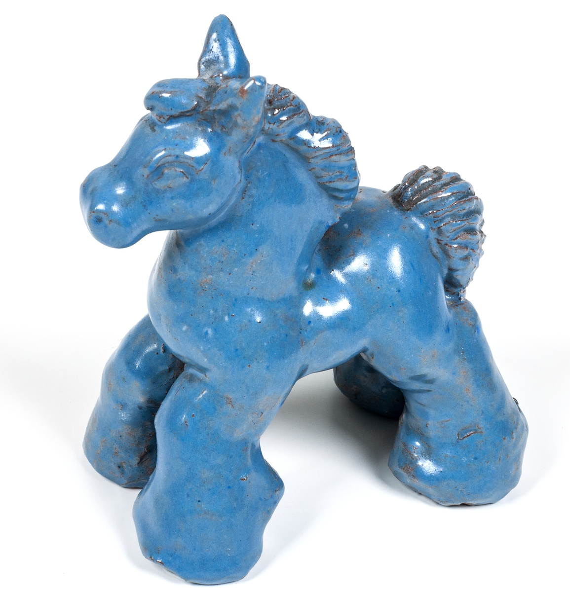 Figurin, häst med ljusblå glasyr, formgiven och modellerad av Märta Willborg 1935 i egen regi.