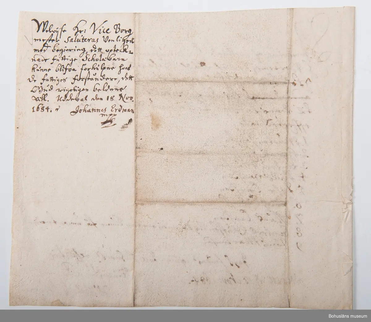 Skrivelse ang. utanordning av kläder till fattiga skolbarn i Uddevalla 18 november 1684.