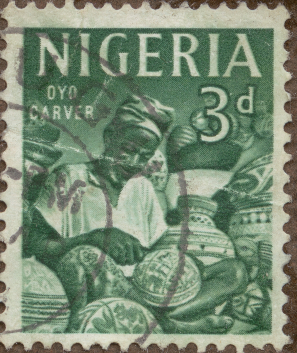 Frimärke ur Gösta Bodmans filatelistiska motivsamling, påbörjad 1950.
Frimärke från Nigeria, 1962. Motiv av träsnidare, Oyo.