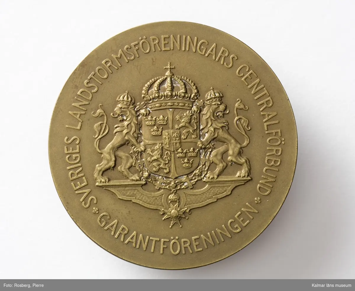 KLM 44229:2 Medalj av koppar i ask. Text: Sveriges Landstormsföreningars centralförbund, Garantföreningen. Text: Med tack för flerårigt medlemskap, Carl.