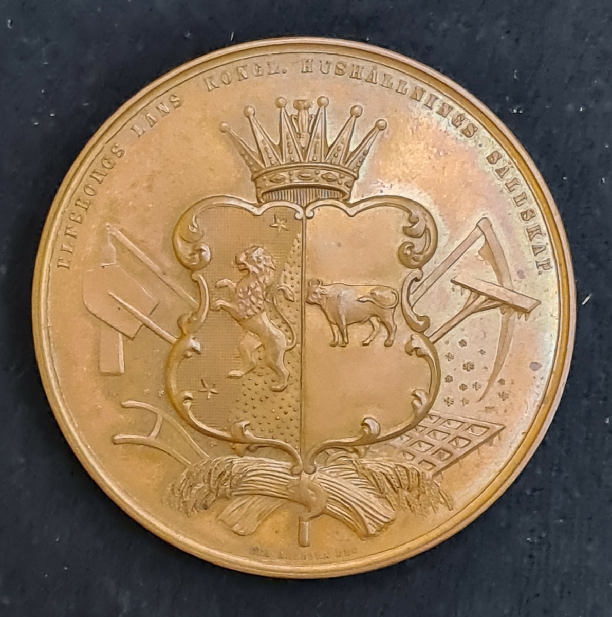Medal, ograverad från Hushållningssällskapet.