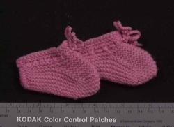 Dukke med  dukketøy, 12 deler