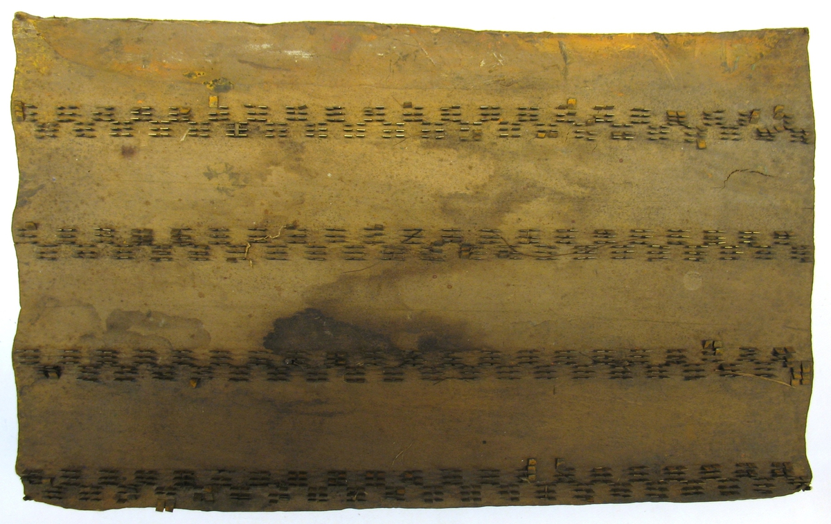 Tryckstock för handtryckning av tapeter.

Tryckstocken består av ett träblock där mönstret utgörs av metallstift.