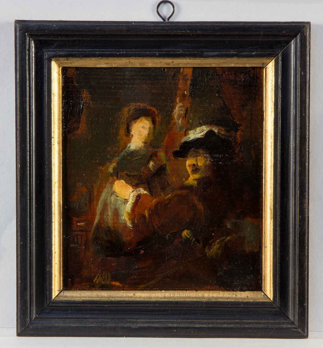 Rembrandt sittande med ansiktet vänt mot betraktaren. I bakgrunden hans hustru Saskia. Skissartat utförande.