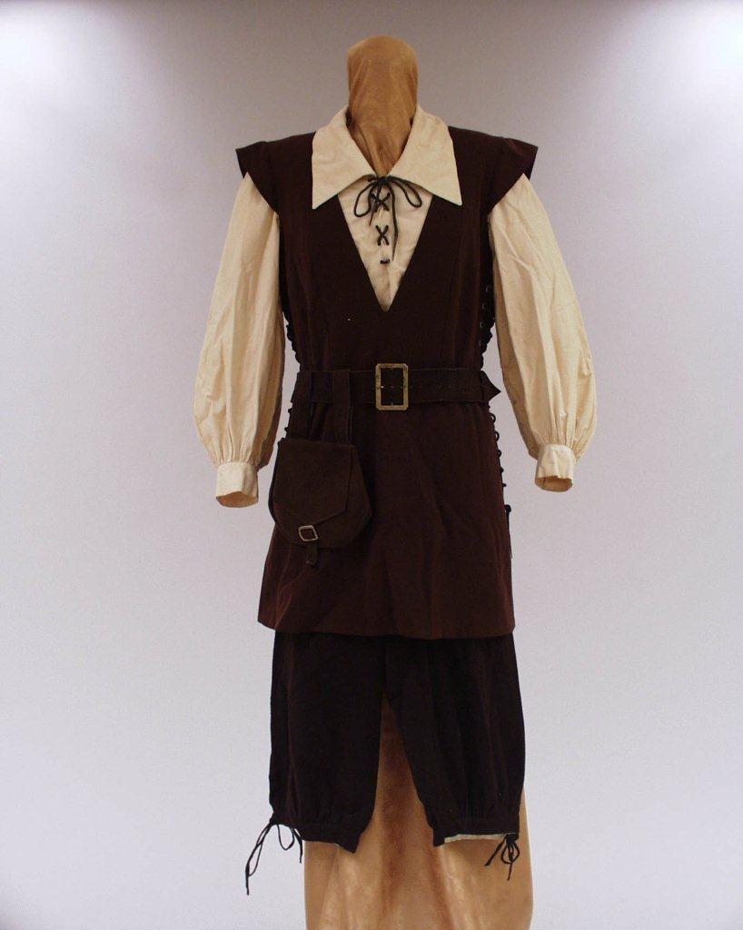 Costume Kirsten Flagstad in the role of Fidelio in Fidelio by Beethoven. A white blouse with a brown leather waistcoat and matching belt around the waist. Brown leather knickerbockers.