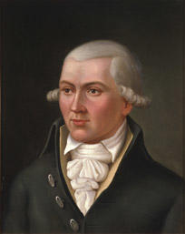 Portrett av Hans C U Midelfart. Grått hår (parykk), mørk kjol (jakke), gul vest, hvit skjorte og halstørkle. (Foto/Photo)