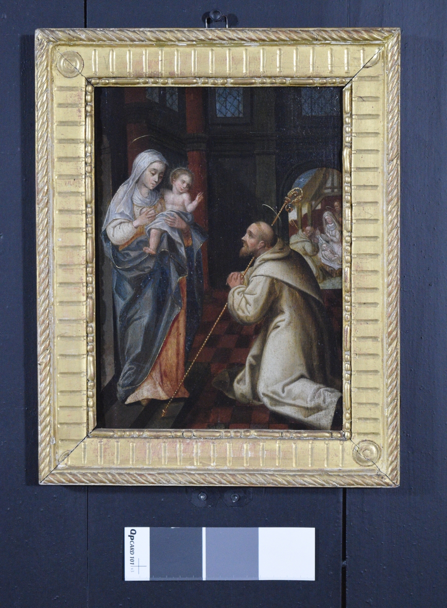Til venstre Madonna med barnet, til høyre munk med glorie og stav. Munken kan være sankt Bernard av Clairvaux. Scenen er omgitt av arkitektoniske detaljer; søyler, høye vinduer og en port. Gjennom porten sees stallen i Bethlehem, med knelende munk, Jesusbarnet, Maria og Josef.