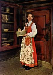 Postkort. Kvinne i bunad fra Romerike. Utstilling NF.