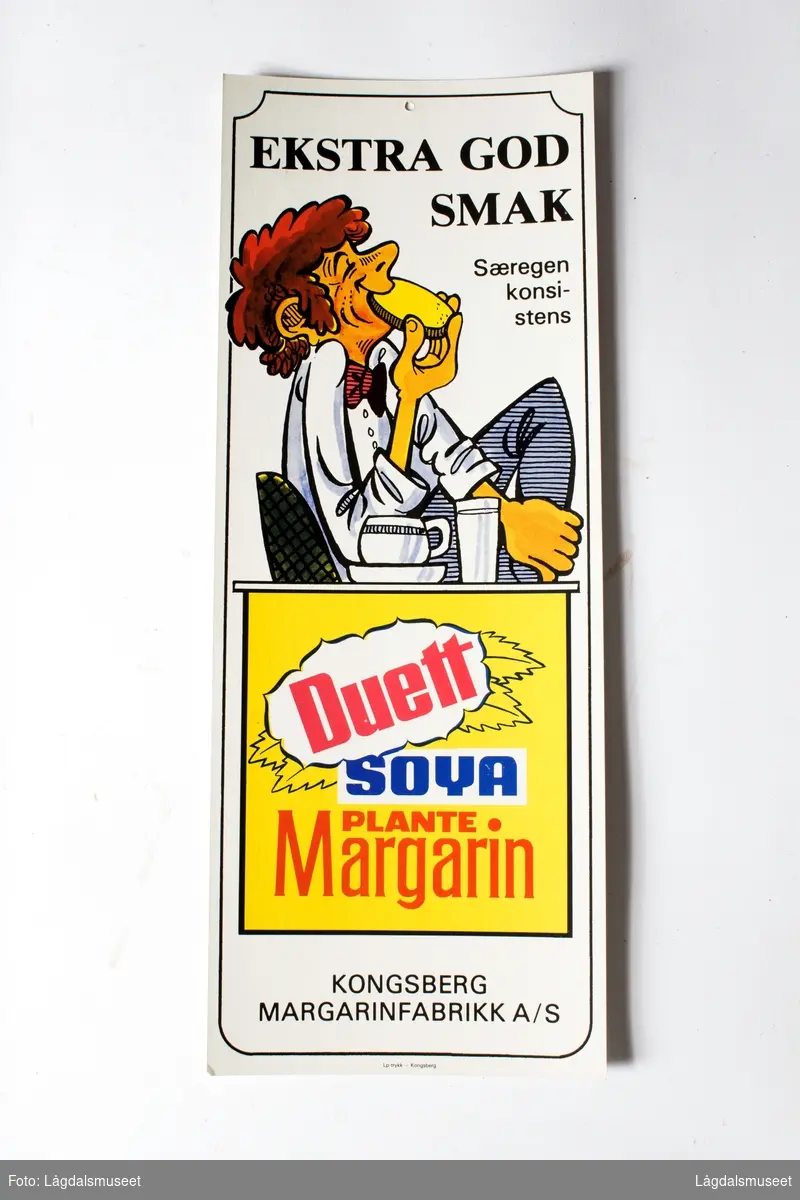 Reklame for smøret "Duett Soya Plantemargarin": Det reklameres for "Ekstra god smak". Motivet viser en gutt som spiser brødskive med margarin.