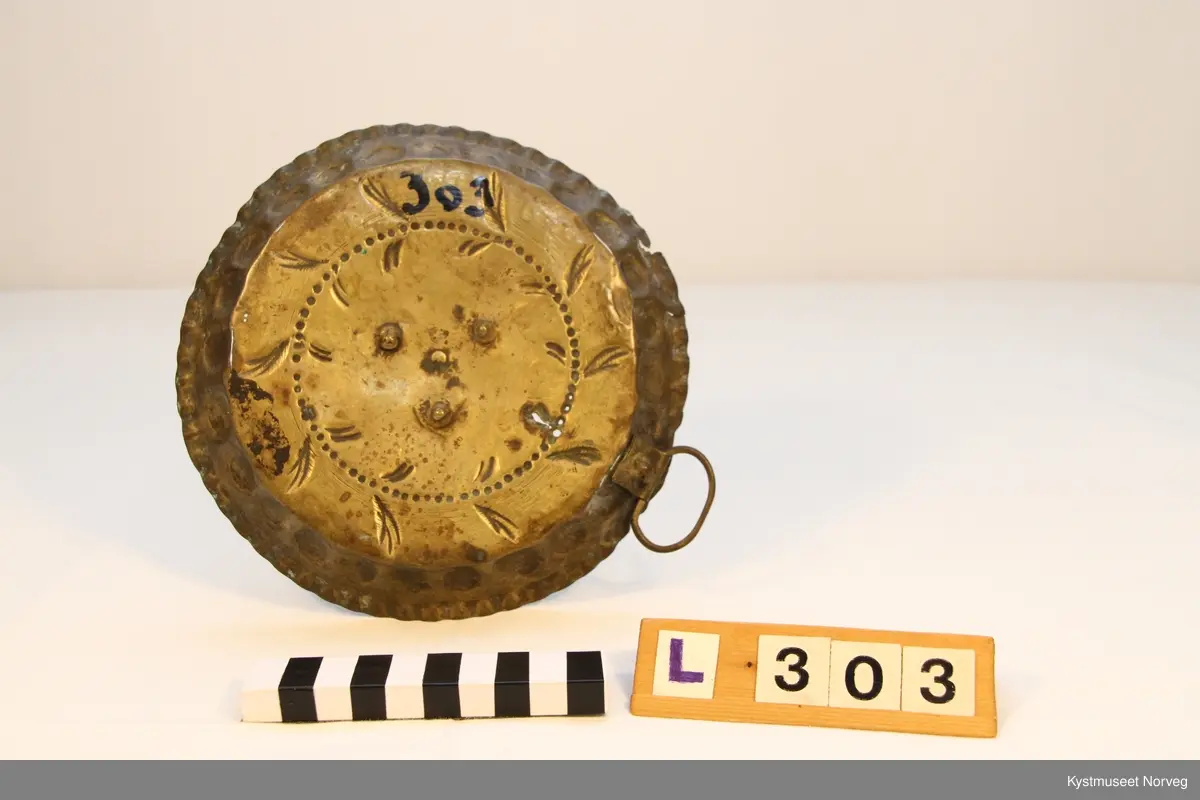 Lysestake av messing.