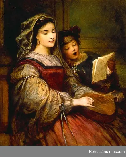 En kvinna ett barn spelar och sjunger tillsammans.