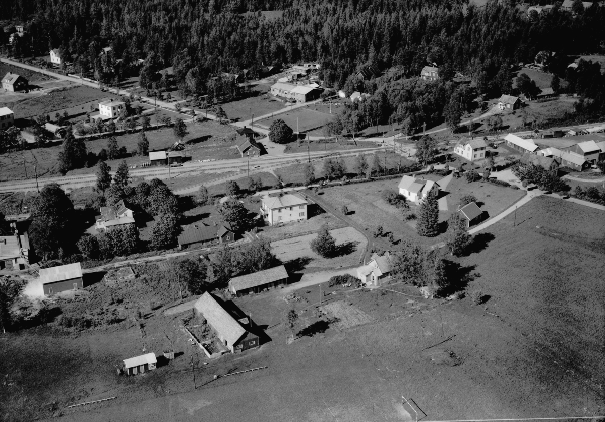 Flygfoto över Nävelsjö i Vetlanda kommun, Jönköpings län. Nr: 445/1957