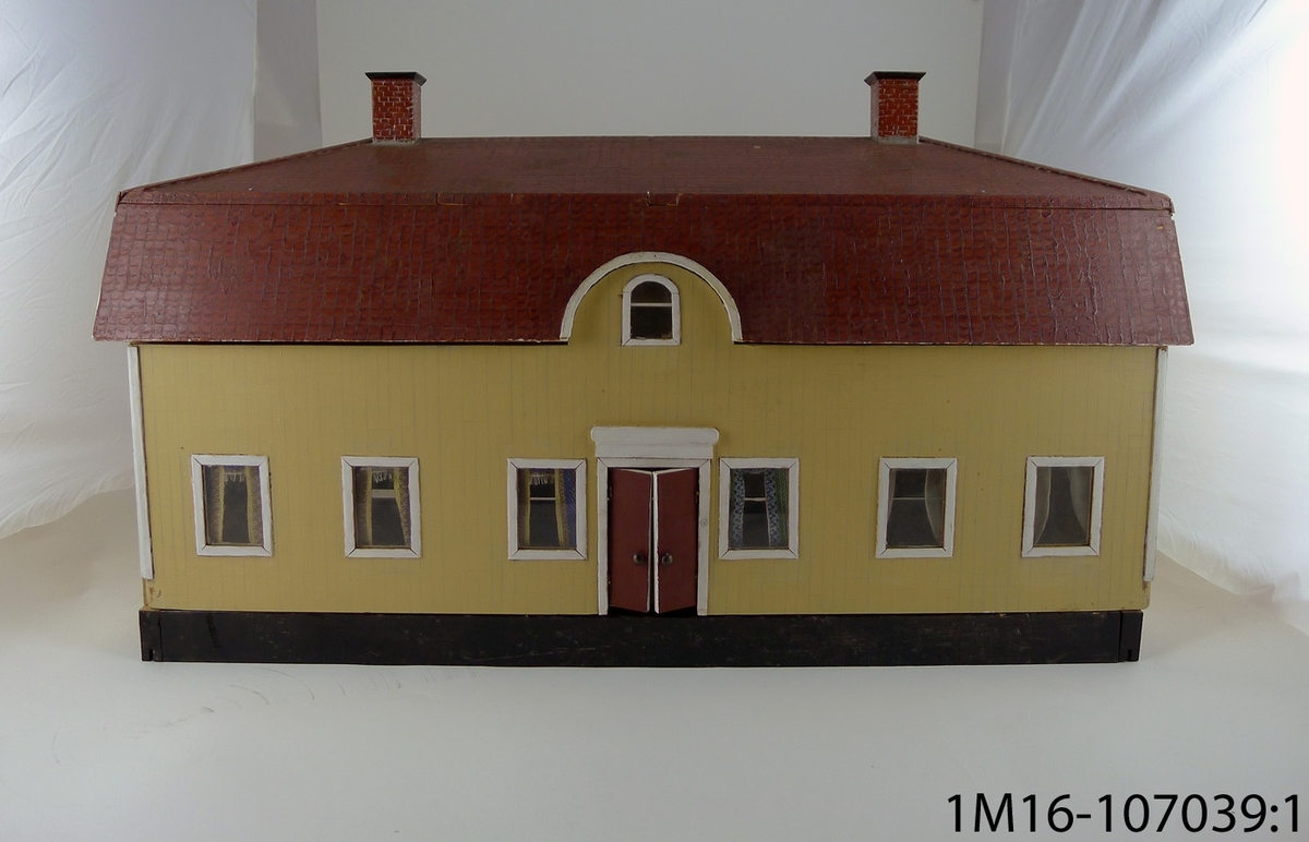 Hus i miniatyr, föreställande Kråks säteri. Handgjort, bemålat.