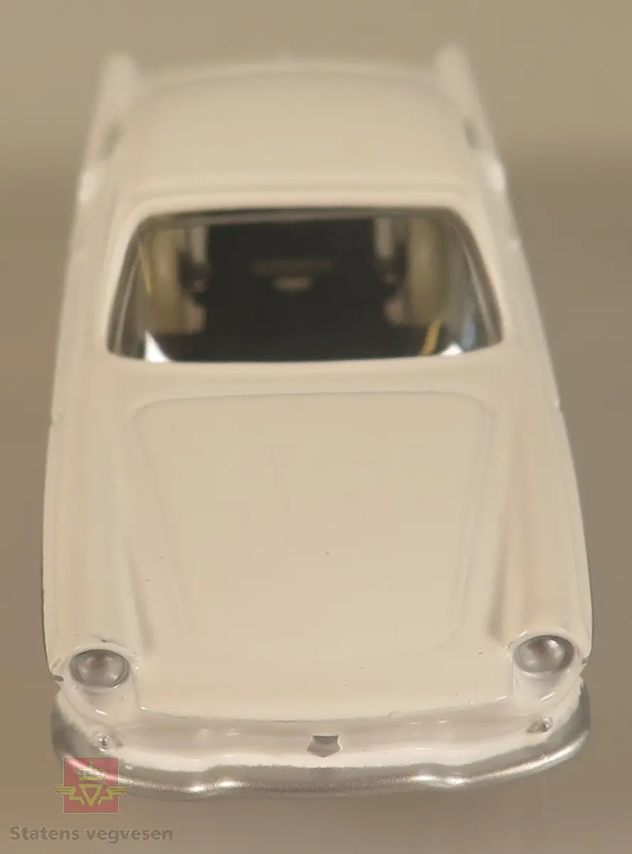 Modellbil av en Renault Floride, modellbilen er hvitfarget med hvite dekk.