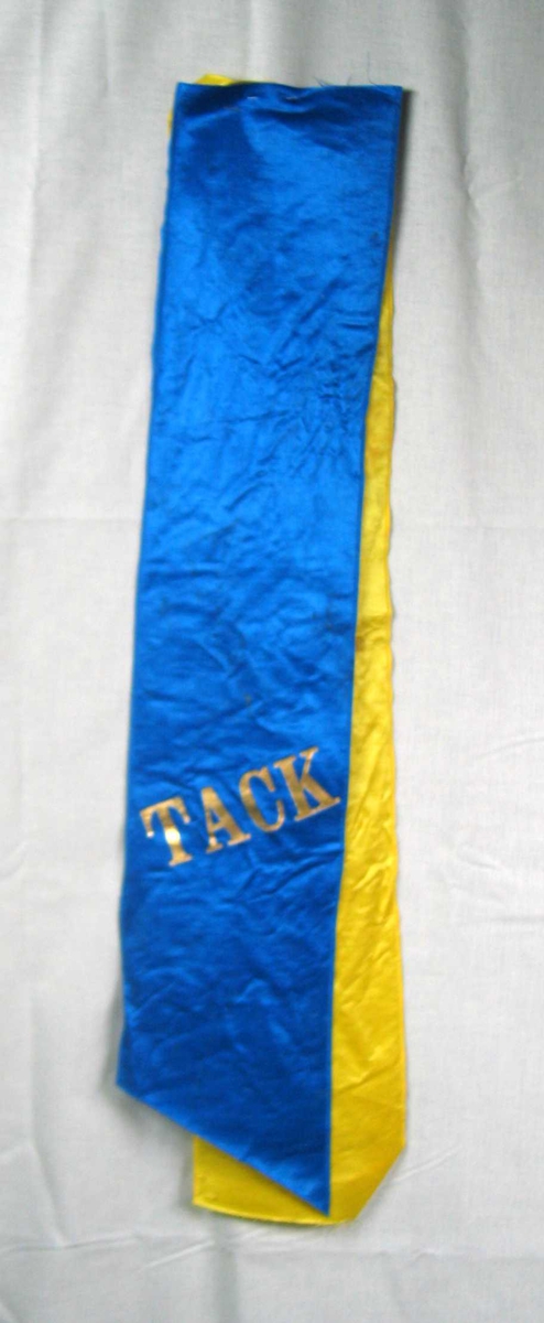 Begravelsessløyfe i blå og gul silke.