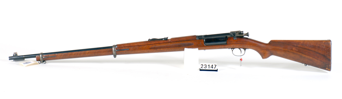 Modellgevær nr 1/1894 utstyrt med varslerinnretning. Dette modellgeværet ble ved kongelig resolusjon av 21 april 1894 approbert som <model ved framtidige geværanskaffelser for det norske infanteri>.
