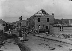Langgt. gjenoppbygging etter brannen i 1897