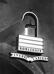 Lysreklame med kranmotiv for rørlegger Sverre Larsen, 1930-t